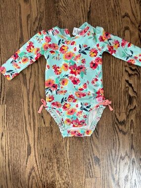 Ruffle Butts Mint Floral Long-Sleeve Baby Swimsuit with Pink and Yellow Flowers